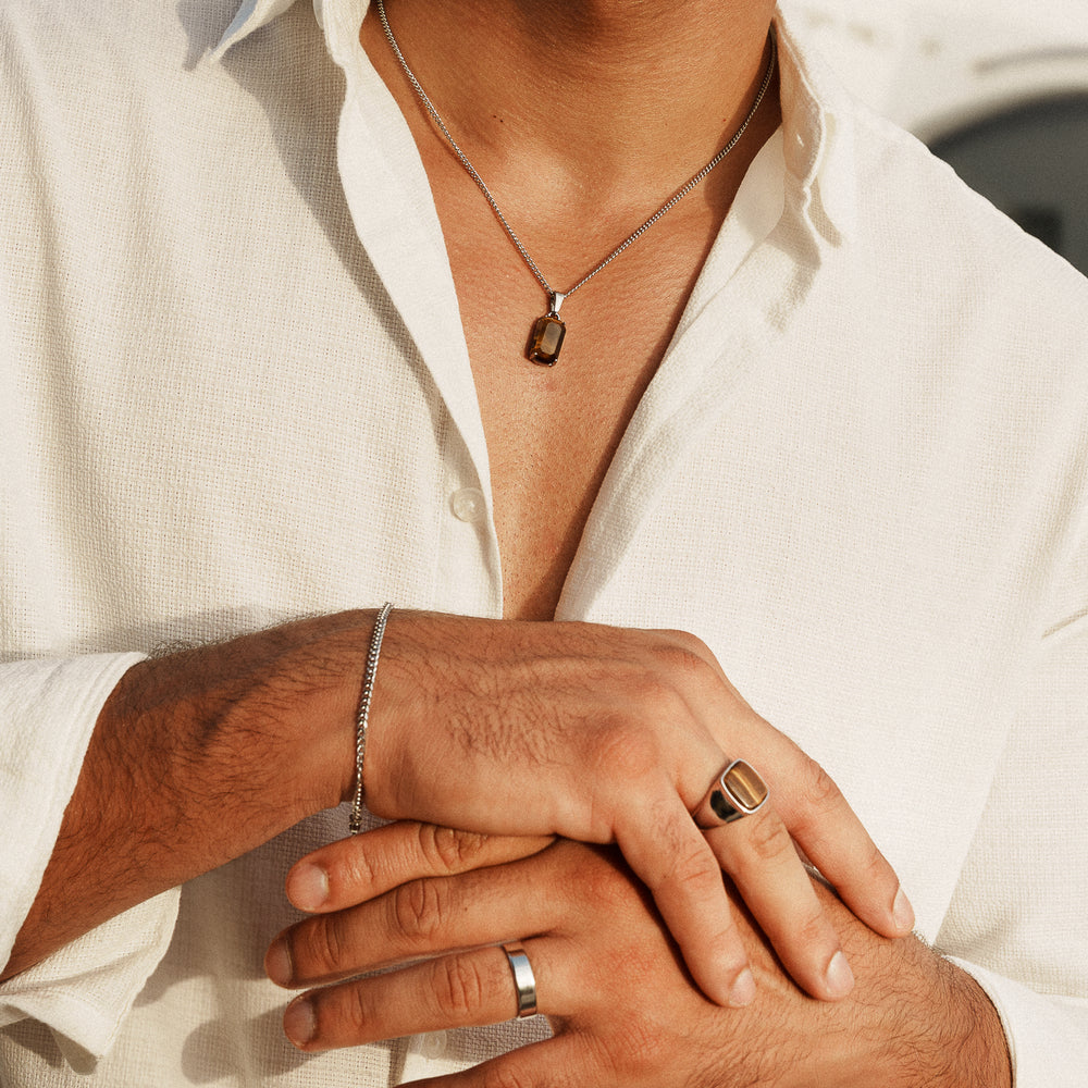 Horizon pendant with Cuban bracelet and Tiger's Eye ring on model